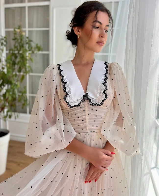 Midi dresses with pleated bodices for a classic and tailored lookClassic Polka Dot Dress