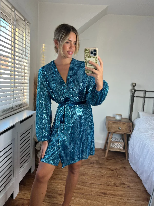 Mini dresses with mesh panels for a sexy and trendy lookDani Sequin Wrap Dress / Peacock Blue